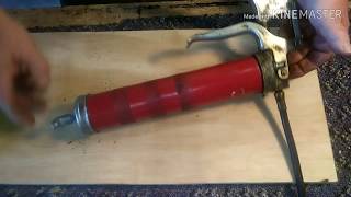 Change a grease gun cartridge  easy [upl. by Fortune115]