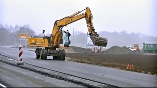 Mobilbagger Liebherr A904 Litronic im Strassenbau  Wheeled excavator Liebherr A904 Litronic [upl. by Nabila476]